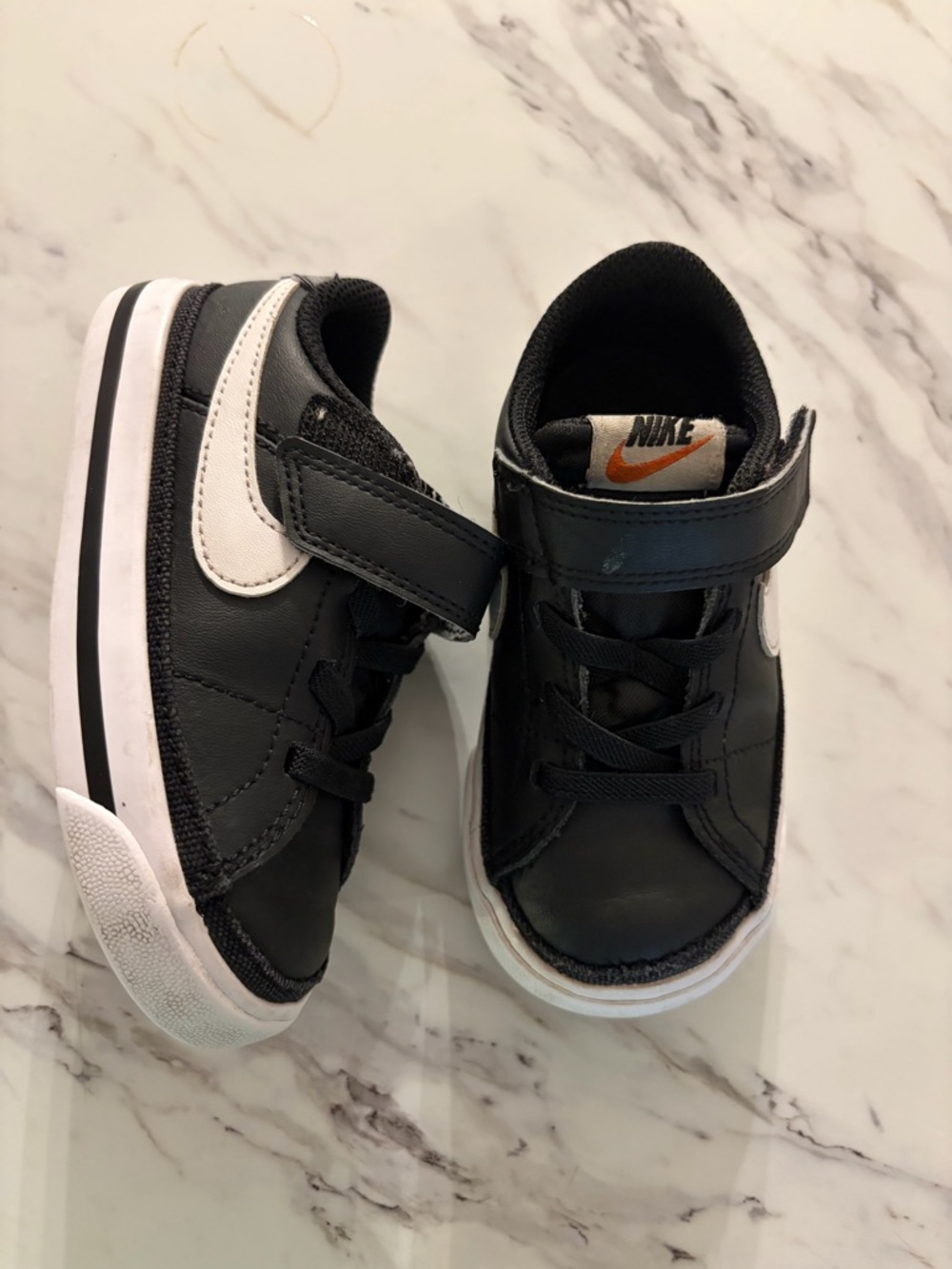 Nike Kids Black and White Velcro Lace-Style Sneakers with Orange Logo